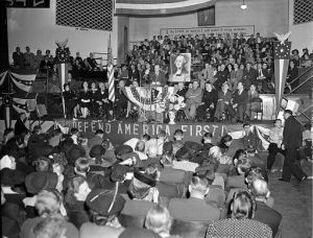 Charles Lindbergh addresses an America First Committee rally with a picture of George Washington on display prior to the Pearl Harbor attack.